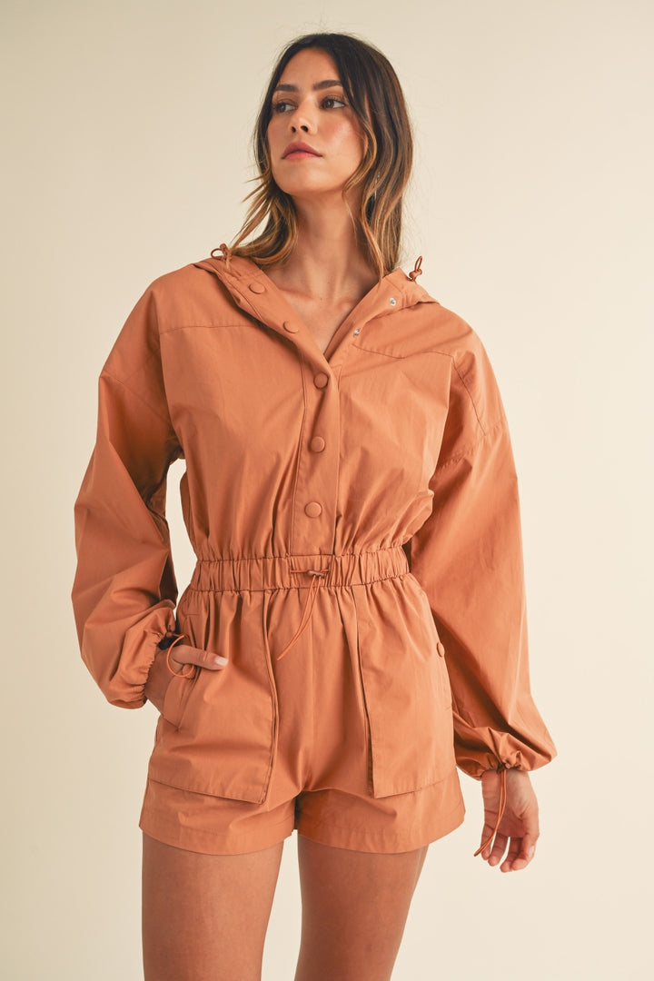 Mable Snap Down Long Sleeve Hooded Romper In Tan