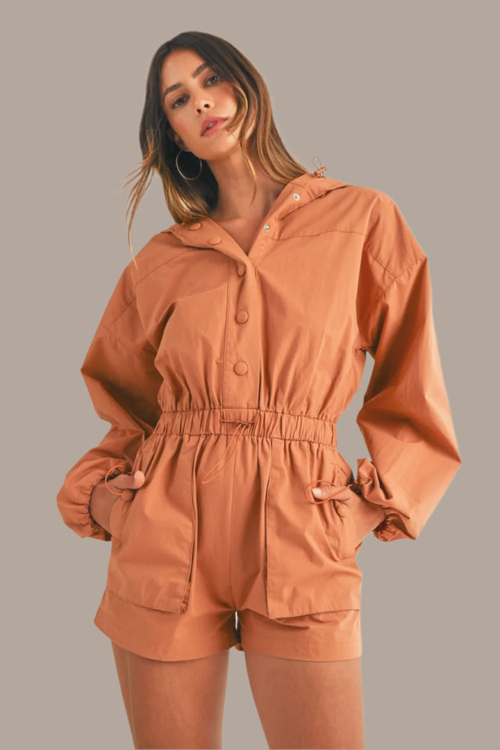 Mable Snap Down Long Sleeve Hooded Romper In Tan