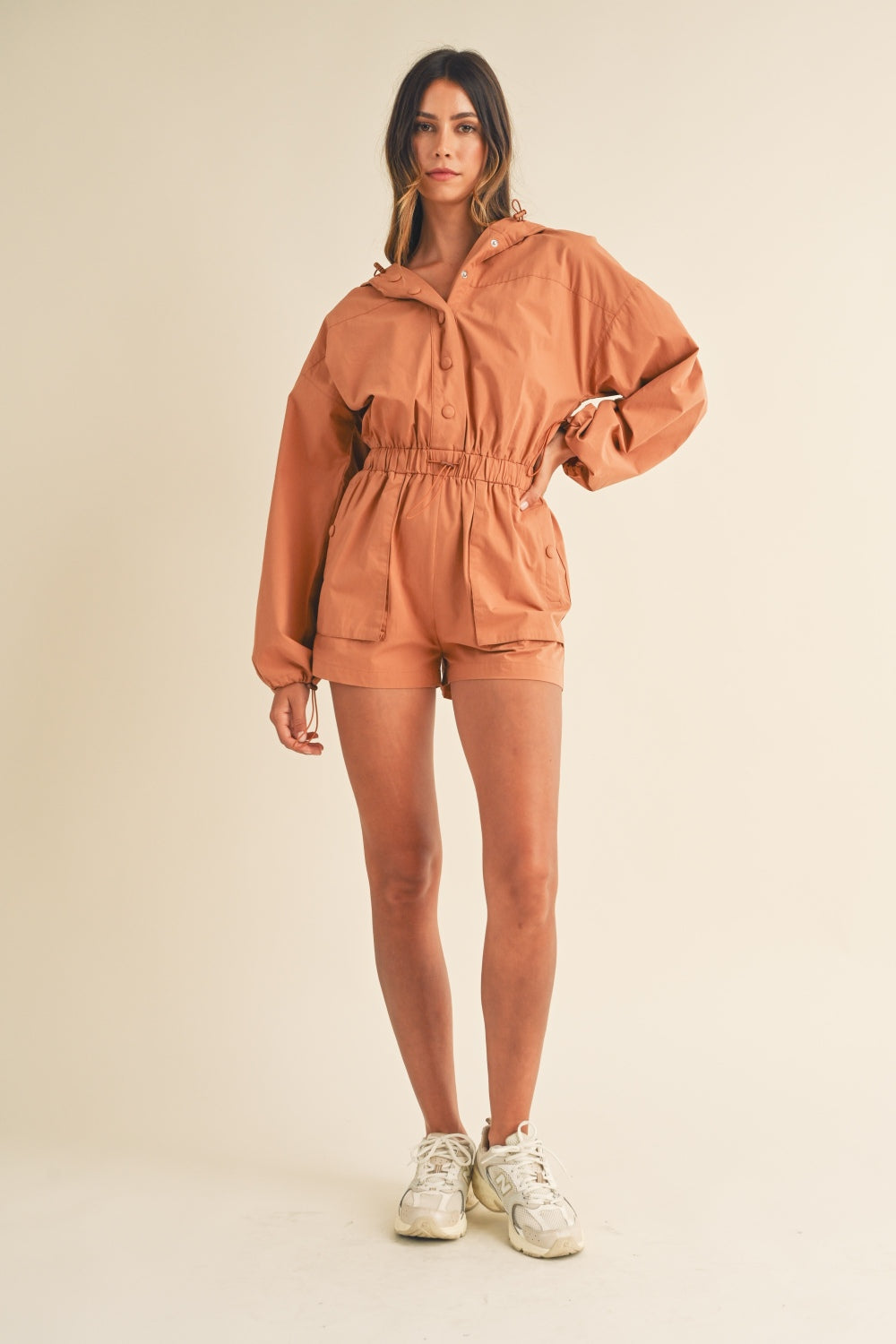 Mable Snap Down Long Sleeve Hooded Romper In Tan