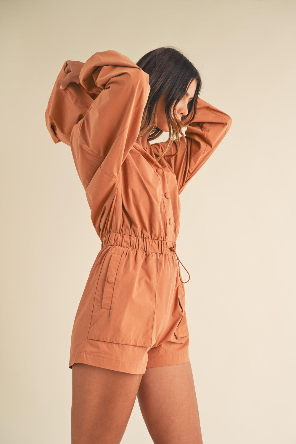 Mable Snap Down Long Sleeve Hooded Romper In Tan